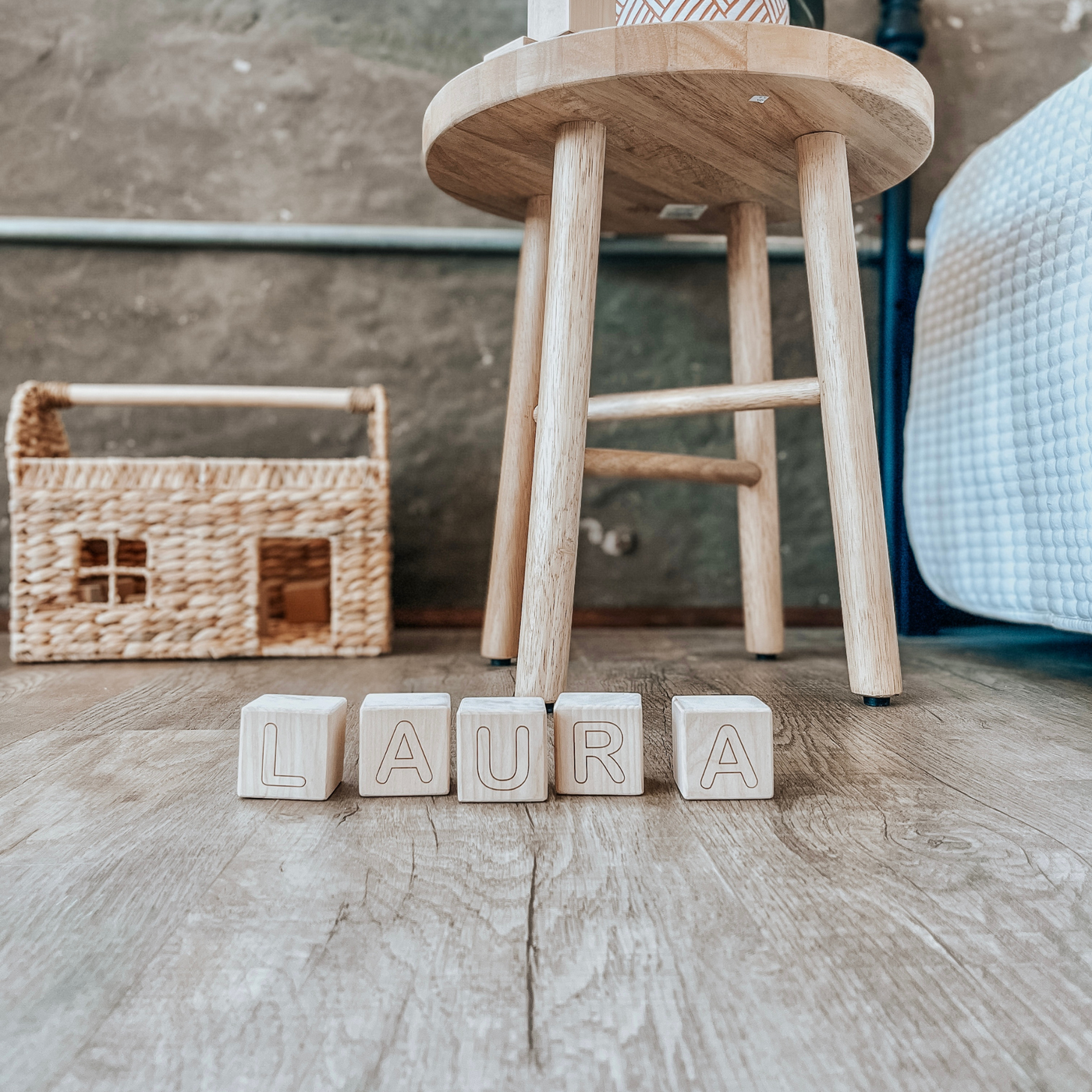 Personalized baby blocks with a name engraved on wooden blocks and used as room decor