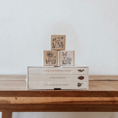 Wooden non-toxic baby blocks engraved with woodland animals used as nursery room decor