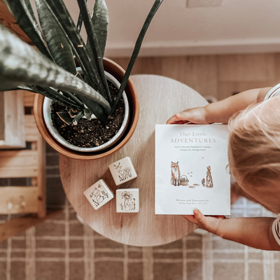 Wooden non-toxic baby blocks engraved with woodland animals used as nursery room decor