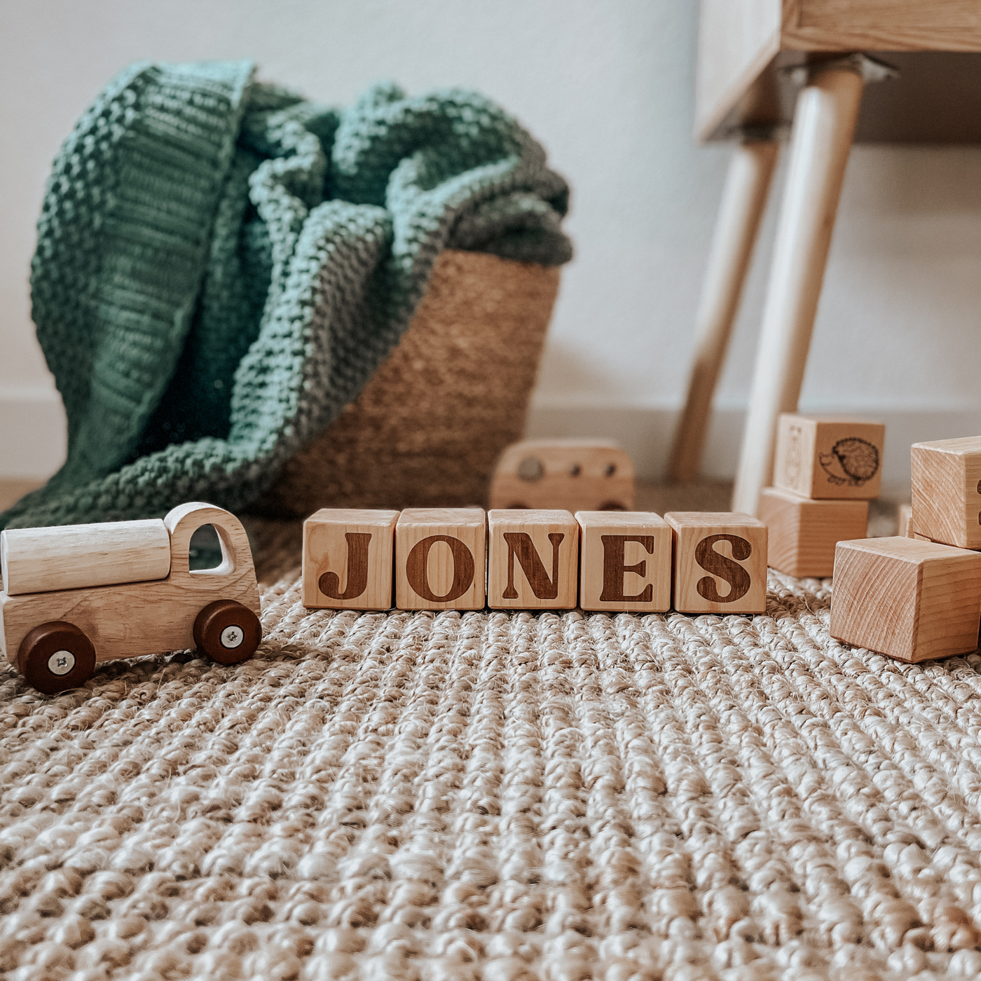 Handmade wooden nursery blocks engraved with the name Jones