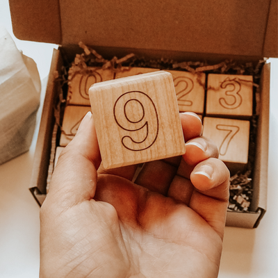Wooden blocks engraved with numbers 0 through 9